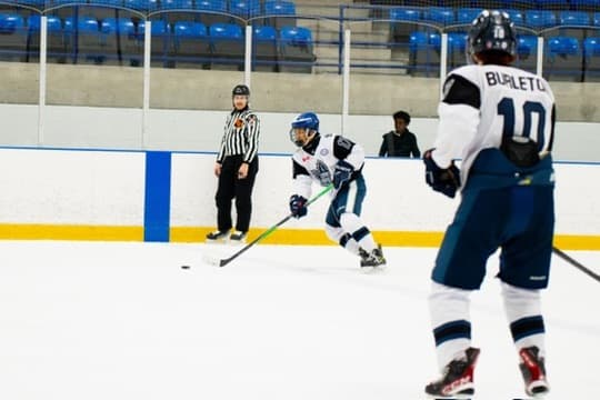 Carrying the puck during a hockey game