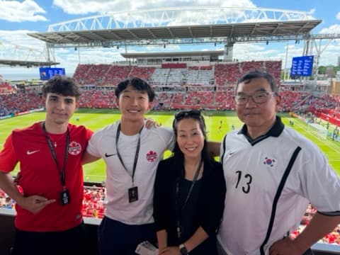 At a soccer match with family